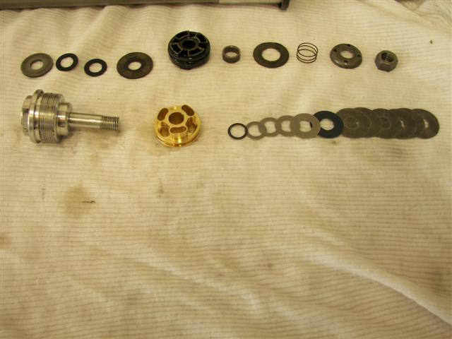 Gold_valve_body_and_shims__Small_.jpg