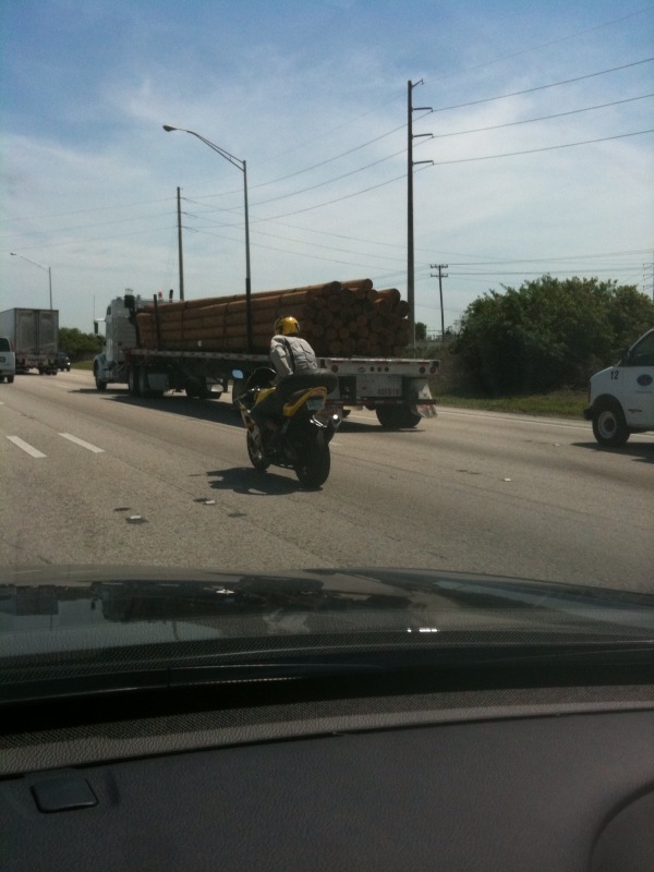 guy carrying tire.JPG